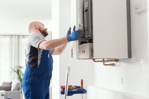 handyman installing cabinets