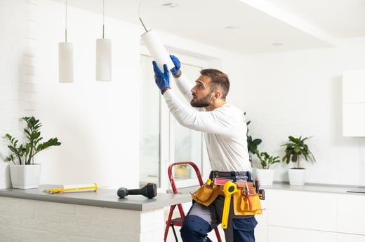 handyman fixing lights